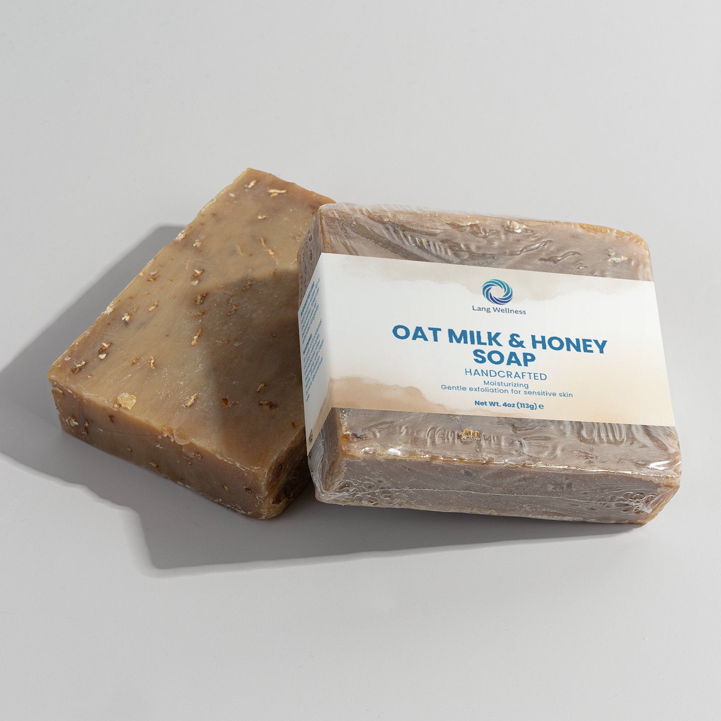 Oat milk & honey soap bar, boxed wrapped bar and a dark brown loose bar