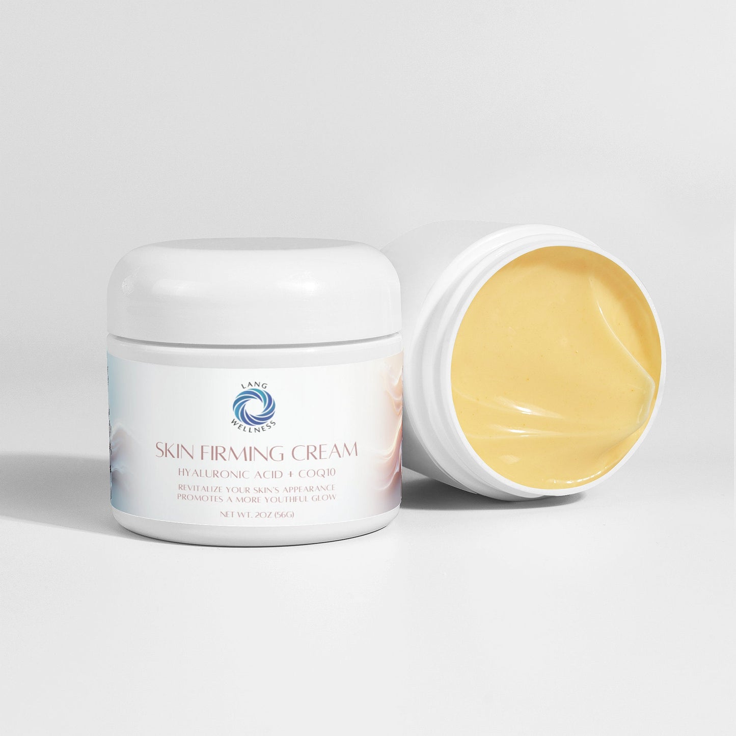 Skin firming cream jar with lid off beside closed jar, yellow cream visible