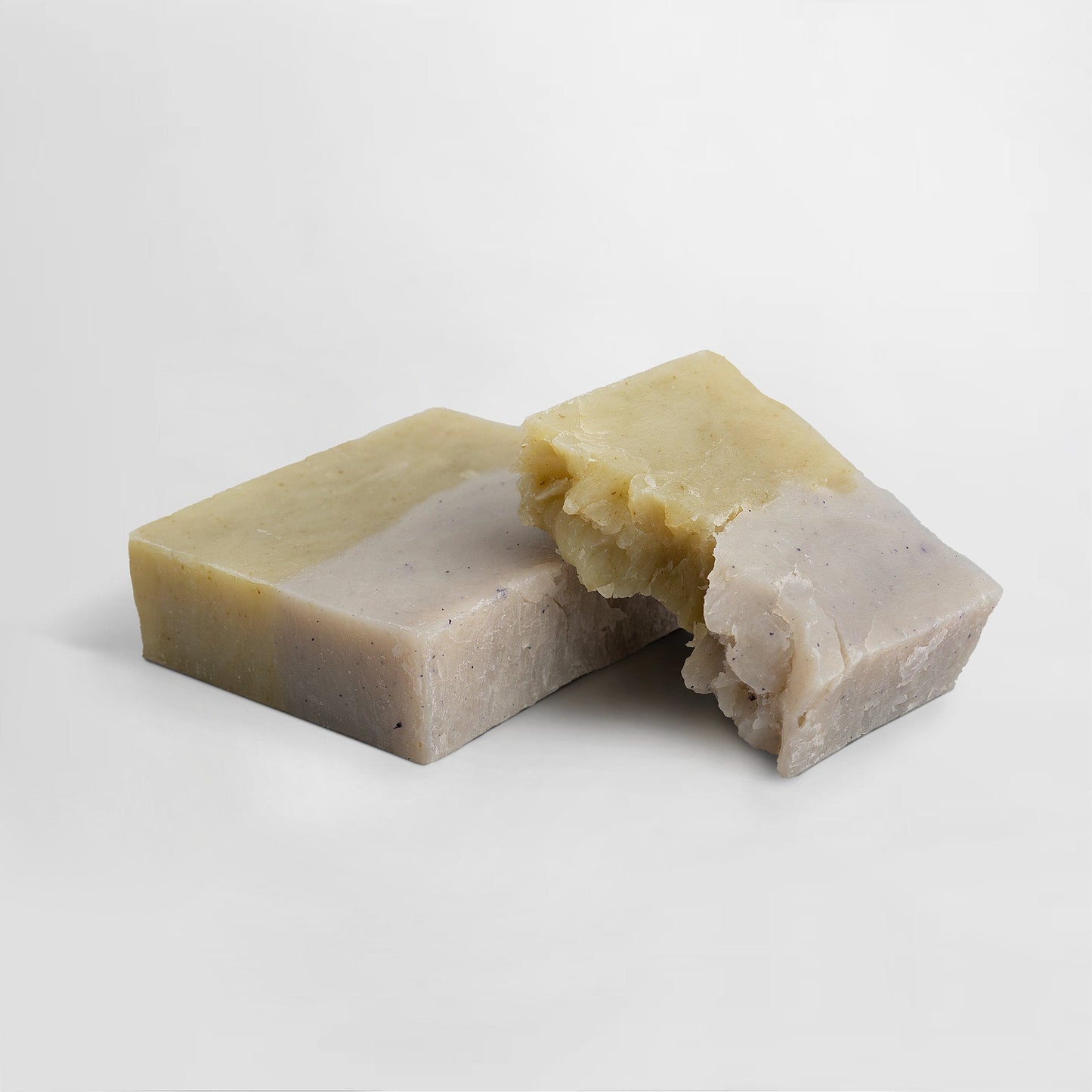 Slumber Soap bar pieces, light beige soap with pale yellow outer layers, broken chunks