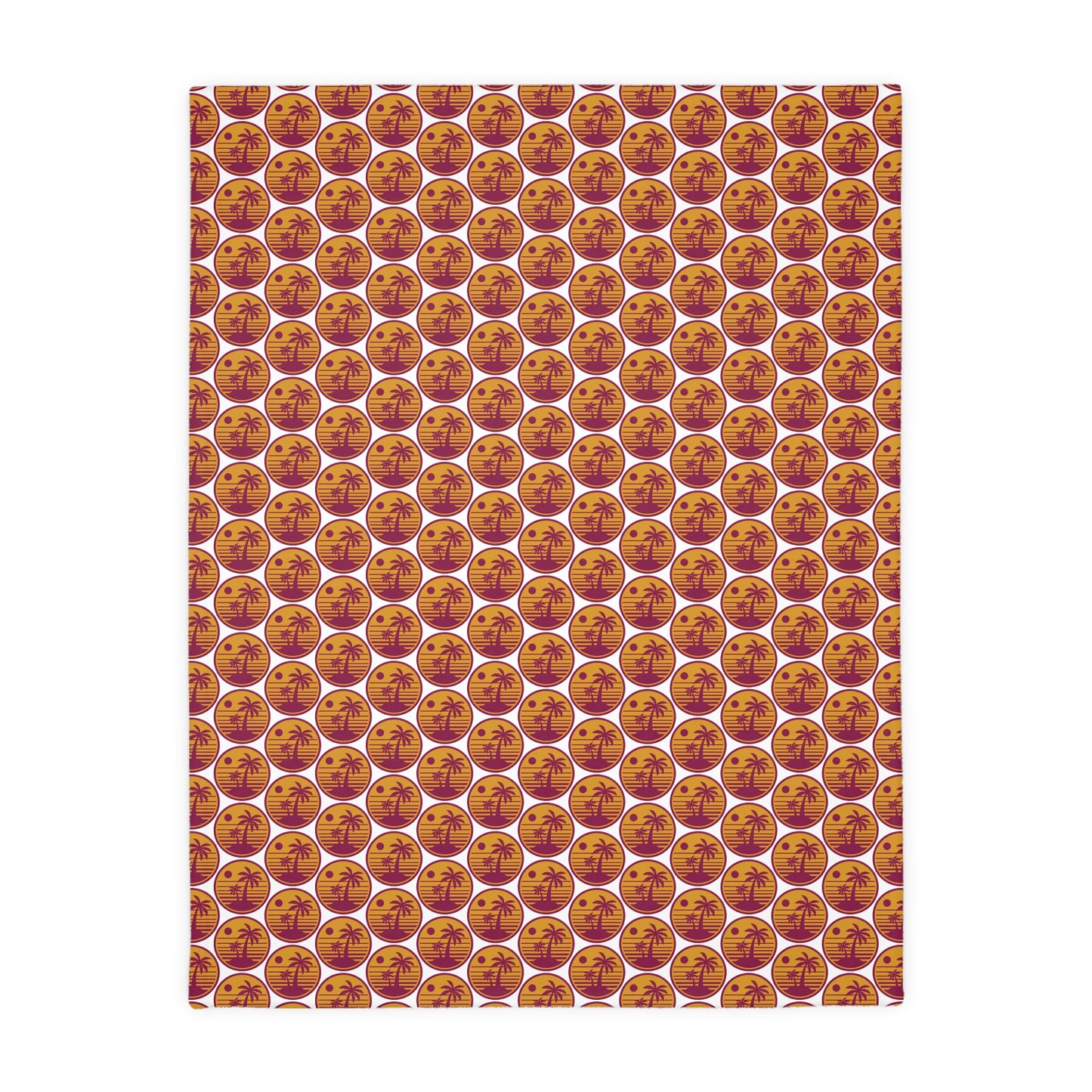 Square throw blanket with repeating pumpkin faces in orange, cream, and gold