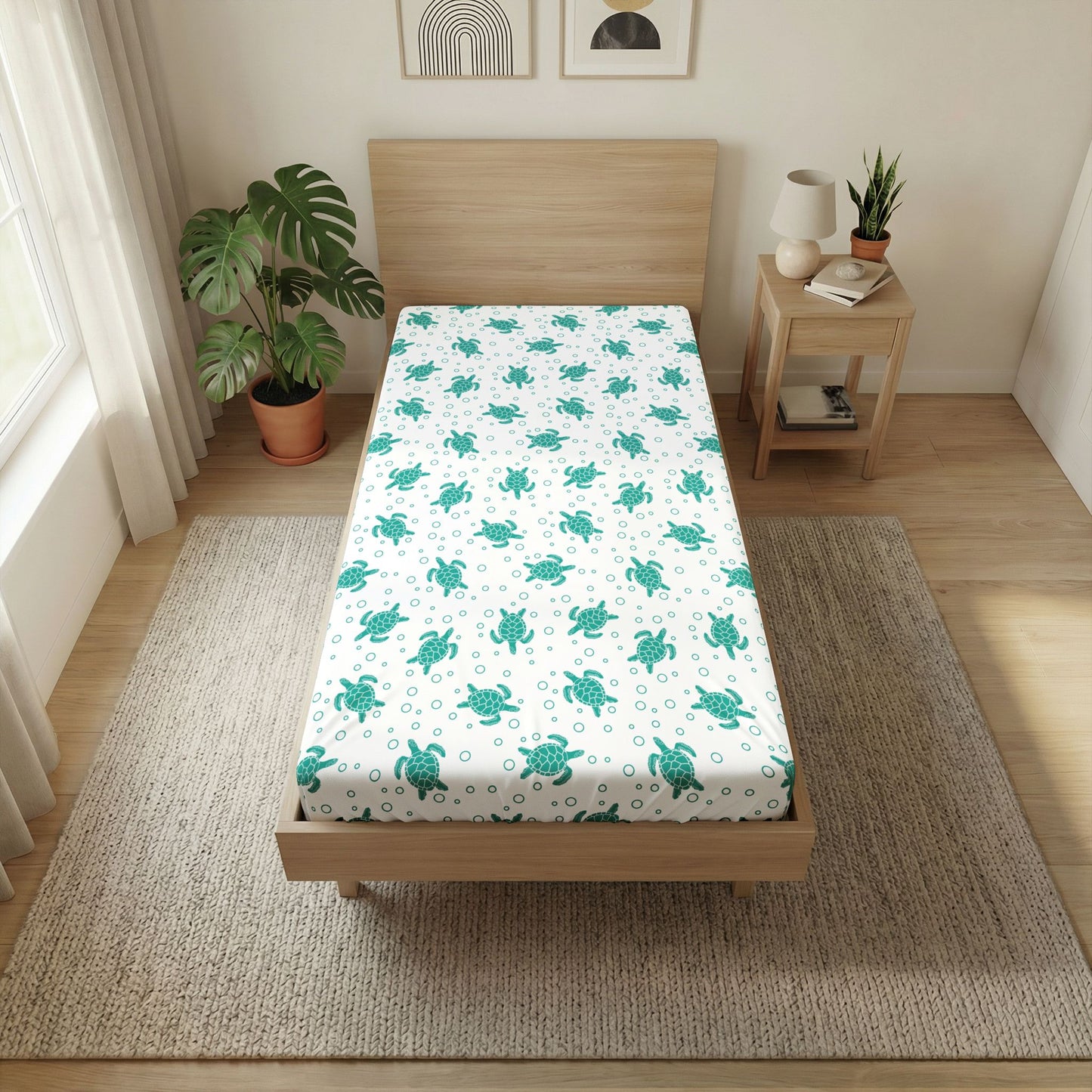 Twin flat sheet with teal sea turtle pattern, neatly fitted on a bed top