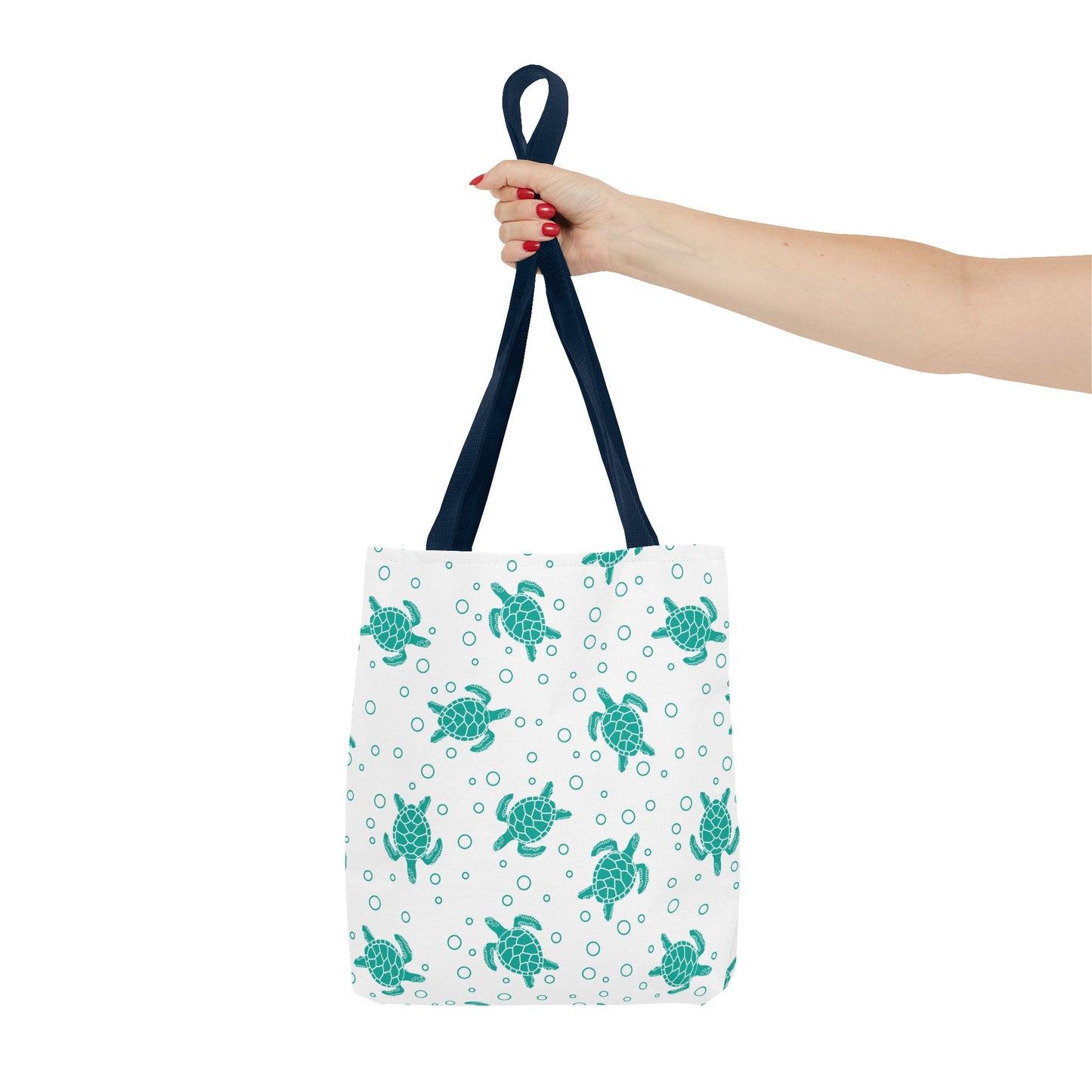 Sea turtle print tote bag with teal turtles on white, navy carry handles
