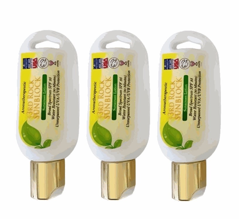 Three mini sunscreen lotion tubes, white and gold with green leaf label
