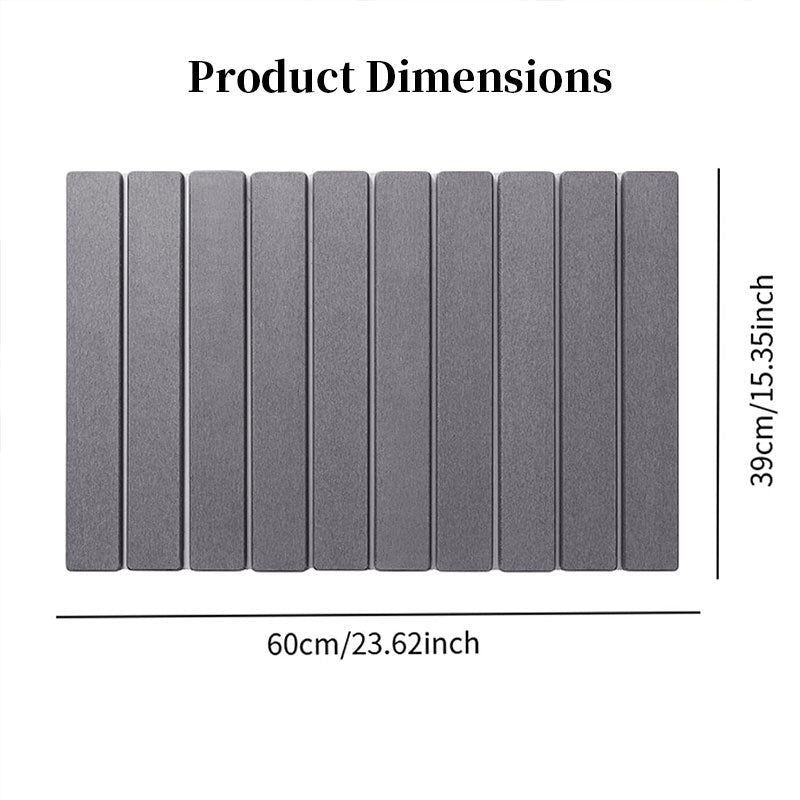 Diatomite bath mat dimensions: 60cm by 39cm; ribbed dark gray surface.
