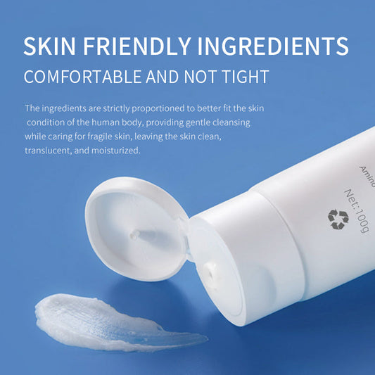 Amino acid facial cleanser bottle dispensing a small amount of foam, 100g.