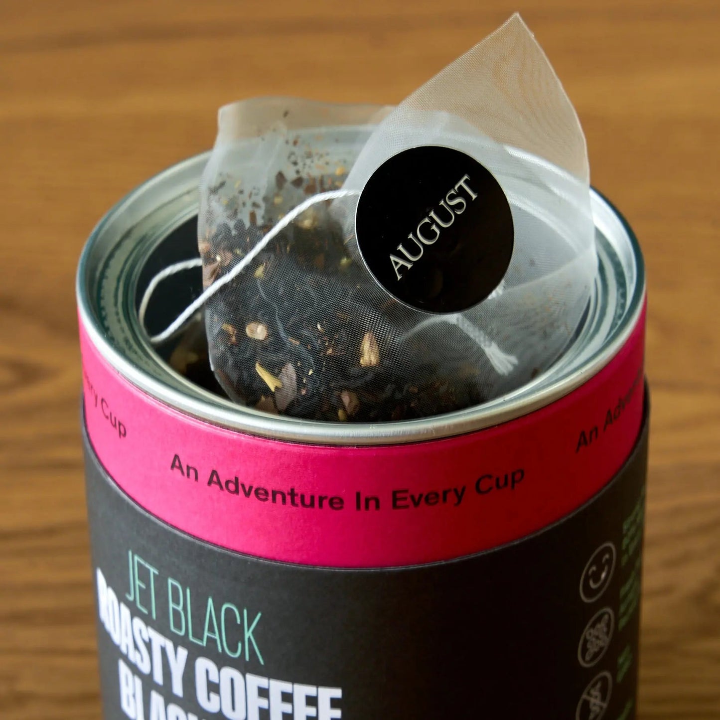 AUGUST Jet Black roasty coffee black tea tin with pyramid tea bags inside