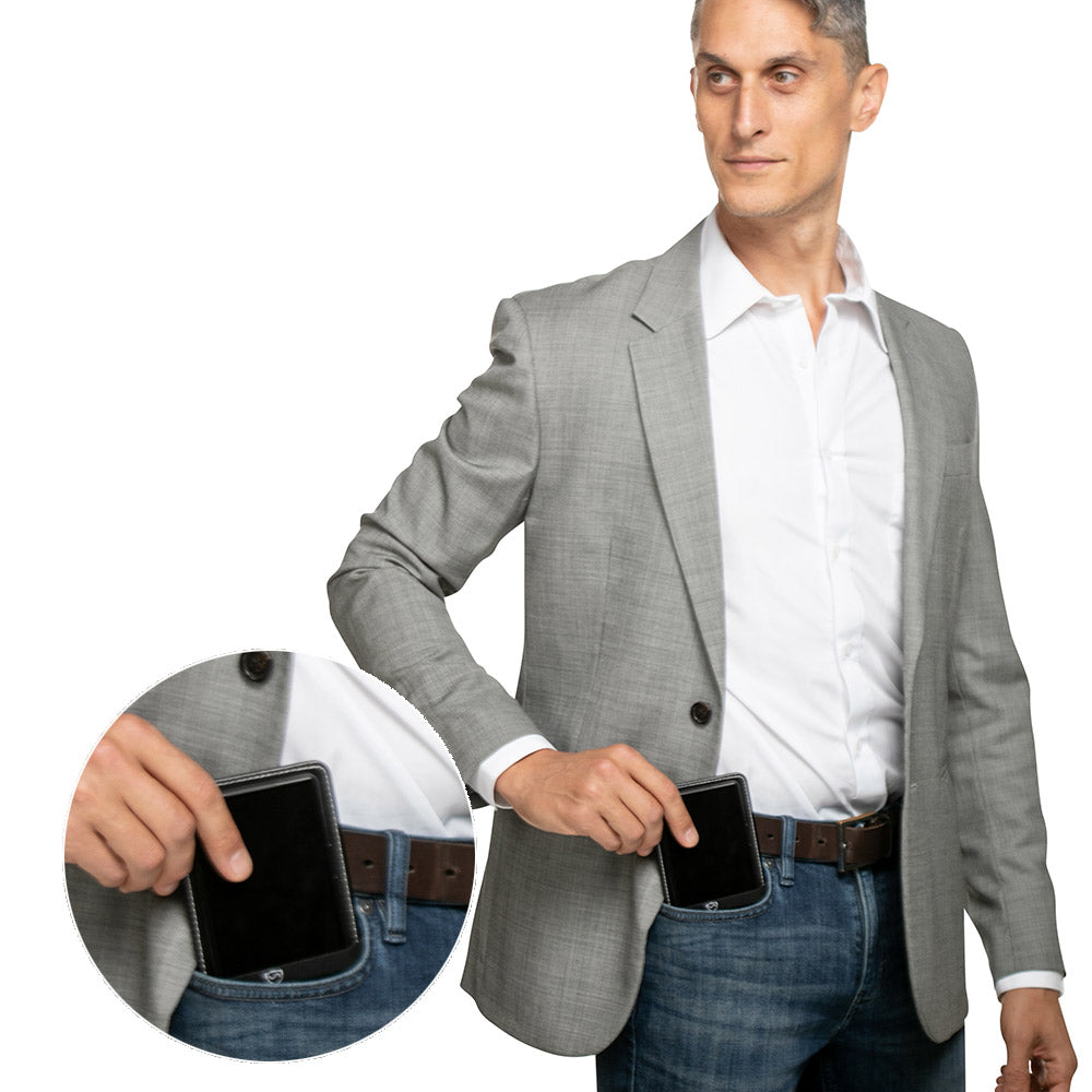 Phone shield holster with black phone case attached to a belt