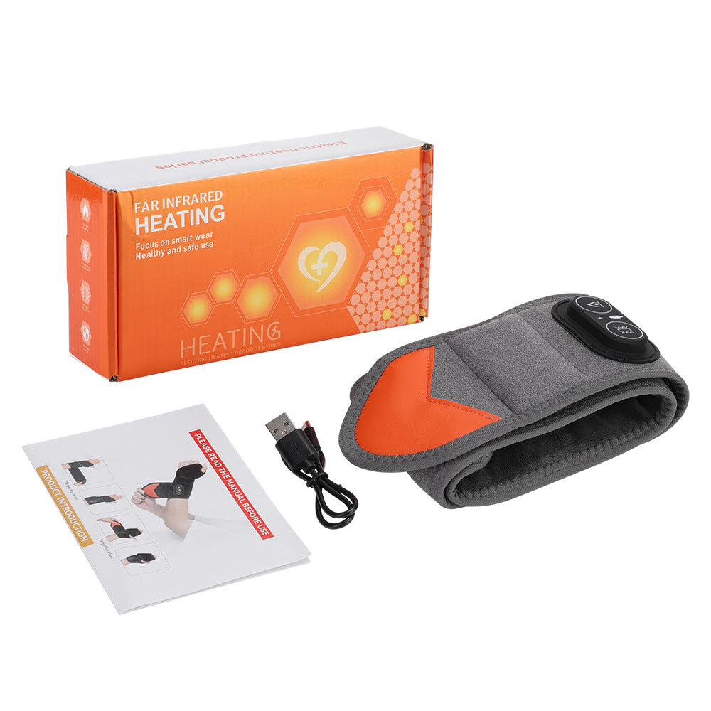 Gray wrist heating brace with black strap, orange-trim accents and control pad