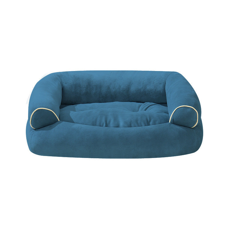 Blue fabric pet sofa bed with padded center cushion and curved side bolsters, beige piping.