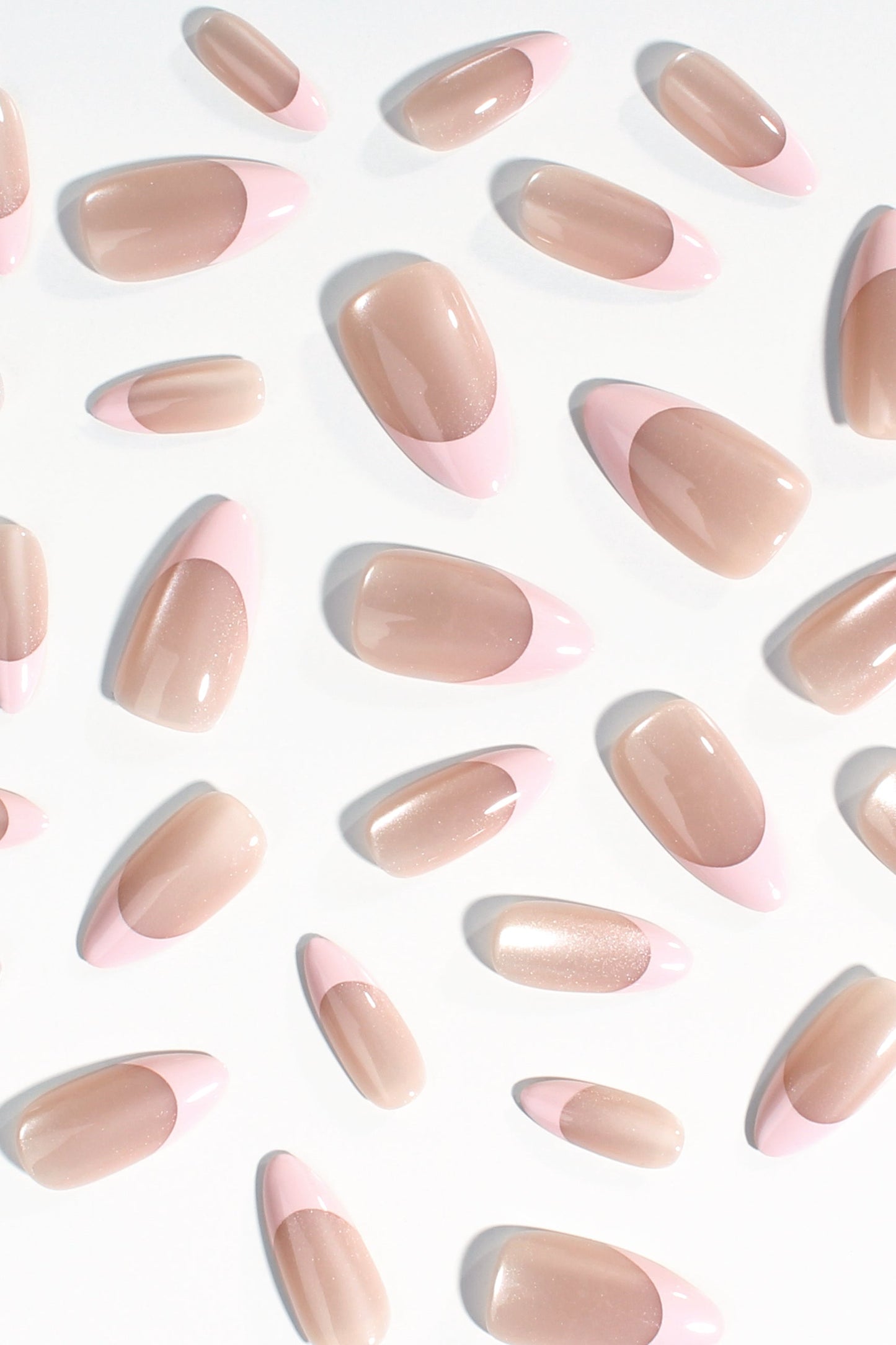 Assorted nude pink oval press-on nails with soft shine
