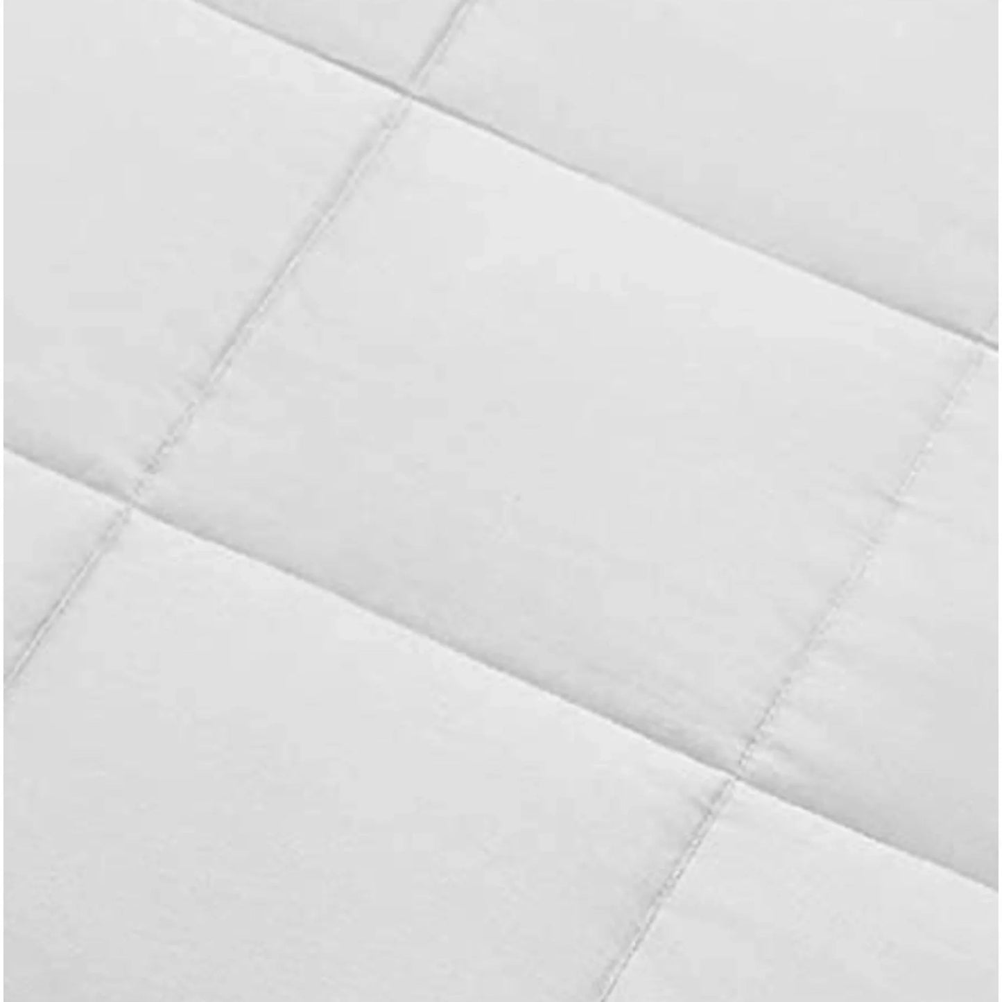 White duvet comforter close-up of stitched quilt channels and seam lines