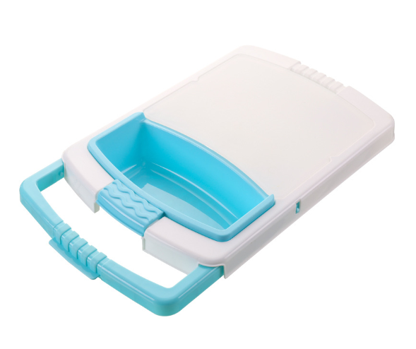 Plastic chopping board with white lid and blue draining tray insert