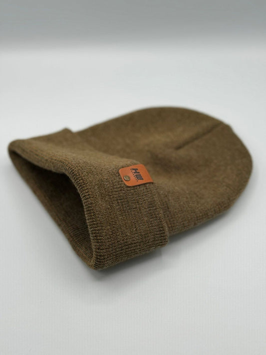Cuffed knit sock in olive-brown, folded with orange logo patch, premium acrylic
