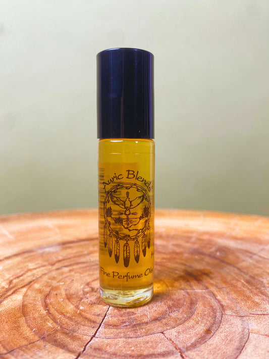 Roll-on perfume oil bottle with amber liquid and dark blue cap