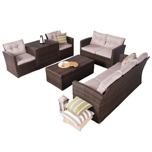 Dark brown wicker sectional with white cushions and matching ottoman/storage bench