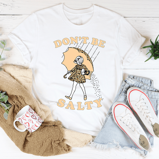 White graphic T-shirt with crew neck and 'DON'T BE SALTY' umbrella girl print
