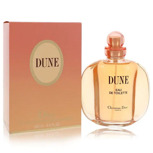 Women’s perfume bottle and DUNE box, gold-toned glass with cap and label