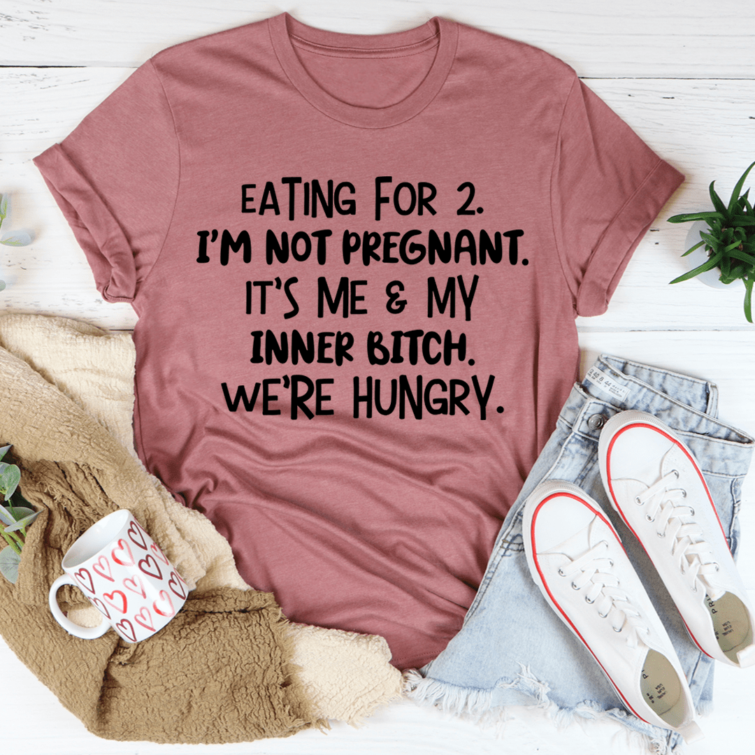 Dusty pink crewneck T-shirt with black slogan text: "EATING FOR 2... WE'RE HUNGRY."
