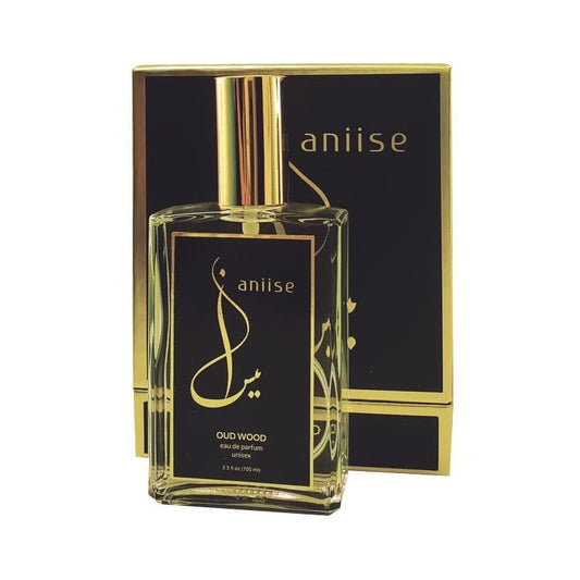 Eau de parfum spray bottle with gold cap and anijise box, black Oud Wood label.