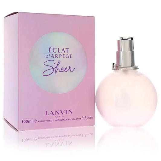 Perfume spray bottle and pale pink box with logo text, silver cap