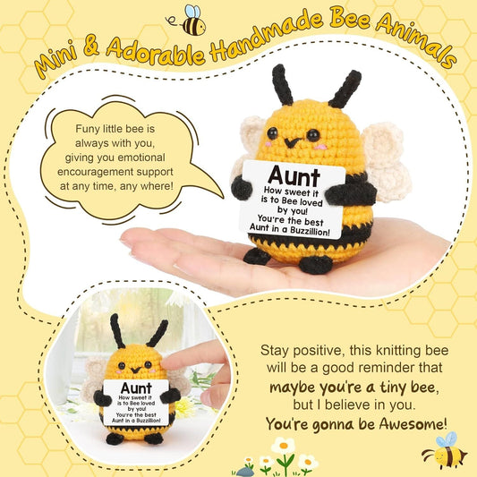 Handheld handmade crochet bee plush, yellow with black stripes, white wings, Aunt label