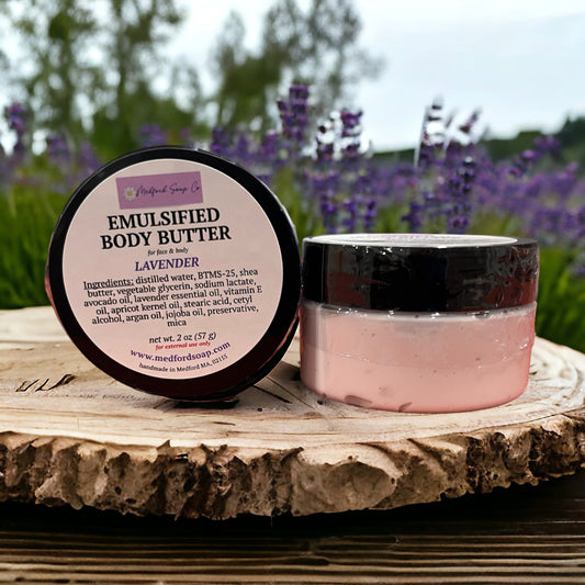 Emulsified body butter jar with black lid, lavender-scented pink butter.