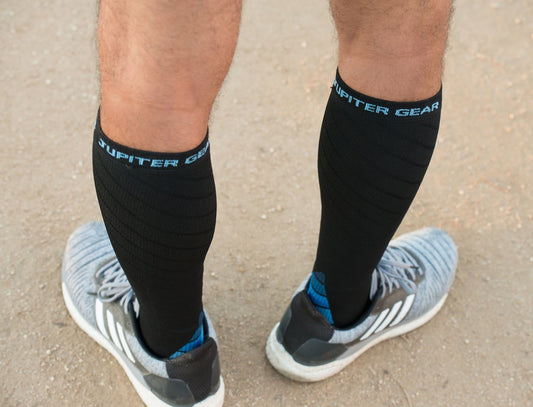 Black compression socks showing blue heel detail and 'JUPITER GEAR' lettering at the cuff