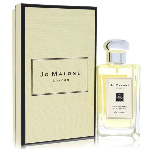 English Oak & Hazelnut eau de cologne: glass bottle with clear cap beside cream box.