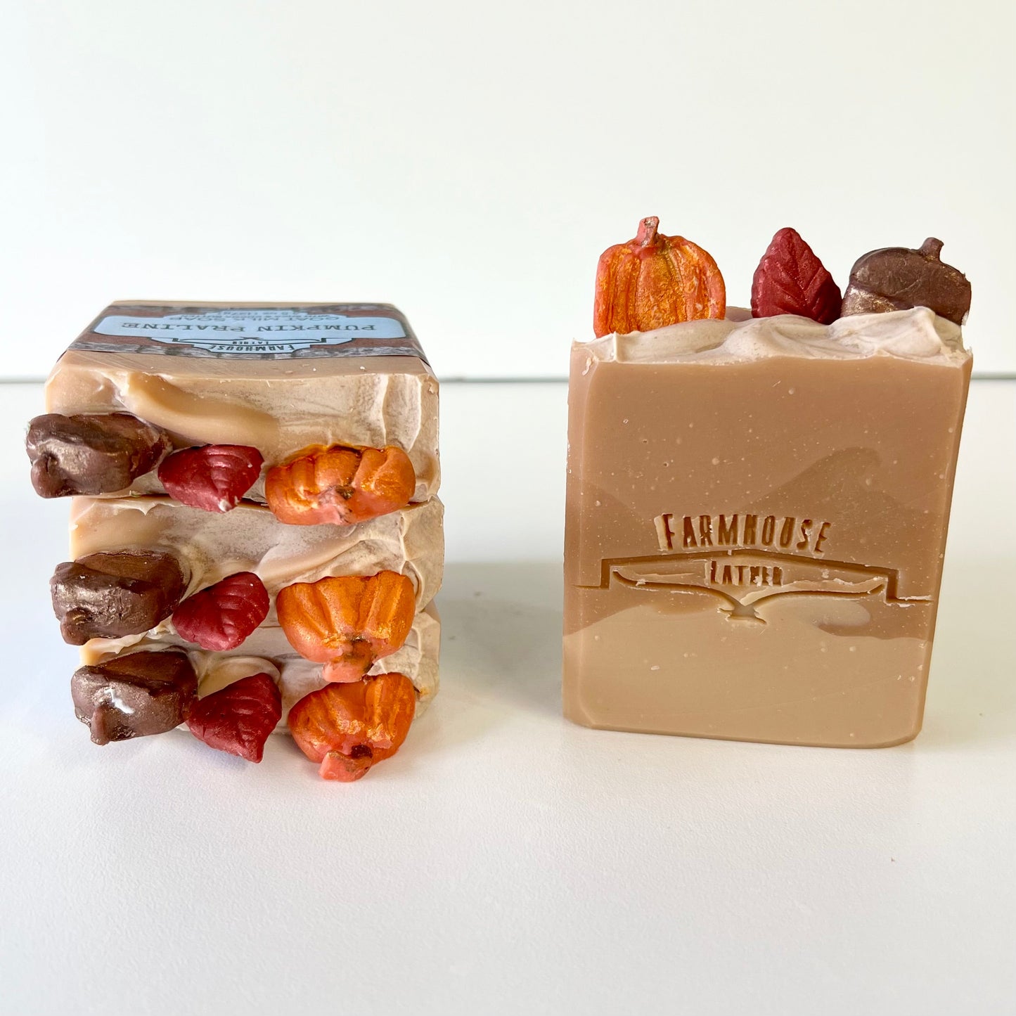 Set of beige goat milk soap bars with embedded pumpkin and chocolate shapes