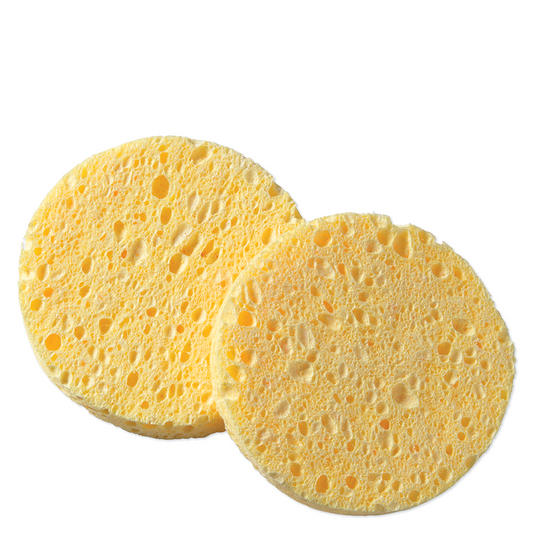 Cellulose cleansing sponge discs with open-pore texture, two yellow rounds