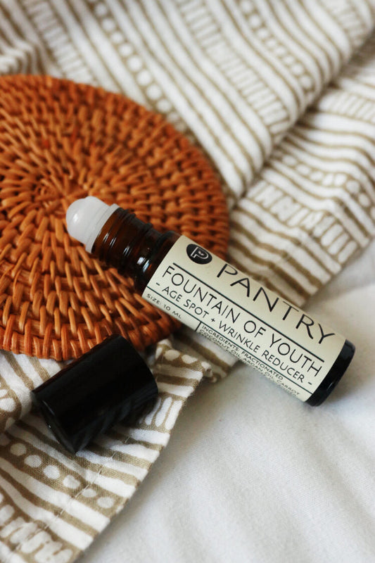 Anti-aging roll-on serum with white roller applicator and label