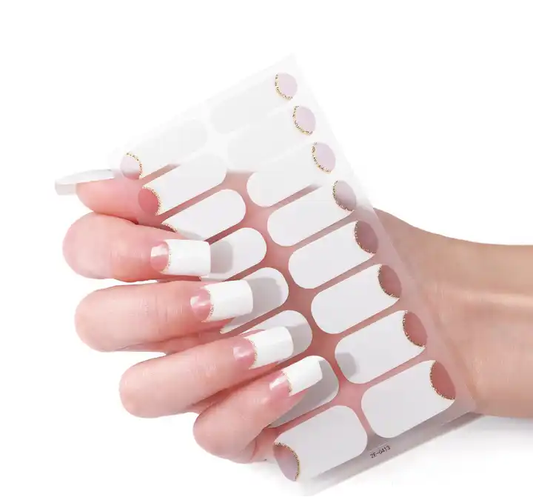 French gel nail tip set on a flexible display strip, nude base with white tips