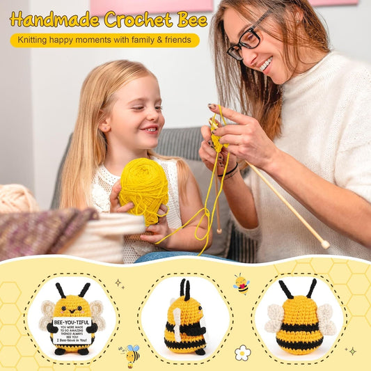 Handmade crochet bee toy with yellow body, black stripes, and white wings
