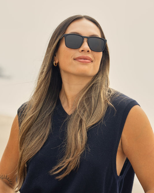 GLACIER polarized sunglasses on a person, black frames with dark lenses