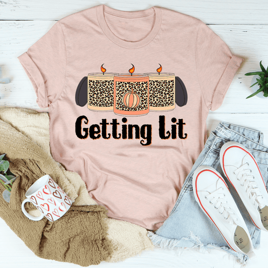 Blush pink T-shirt with "Getting Lit" fall candles print and leopard-pattern panels