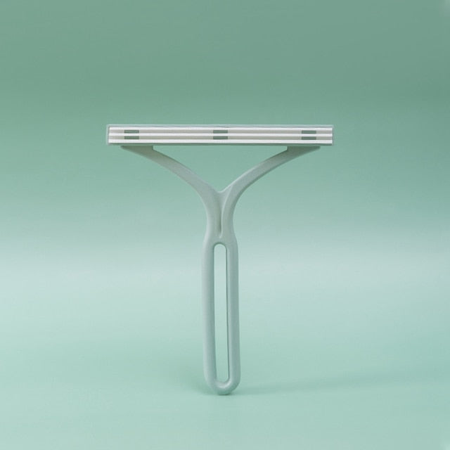 Handheld lint remover tool with cartridge head and tapered long handle