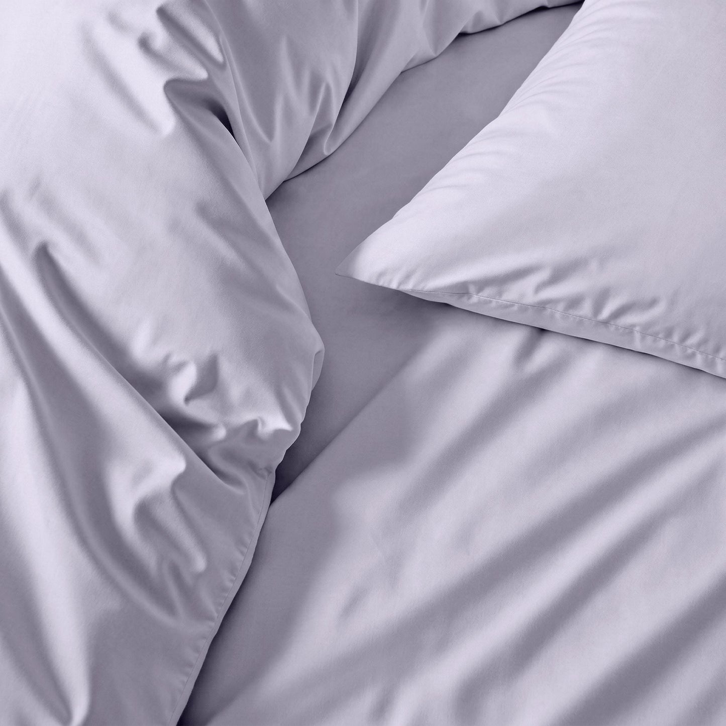 Lavender and gray sateen duvet cover, close-up of smooth fabric folds