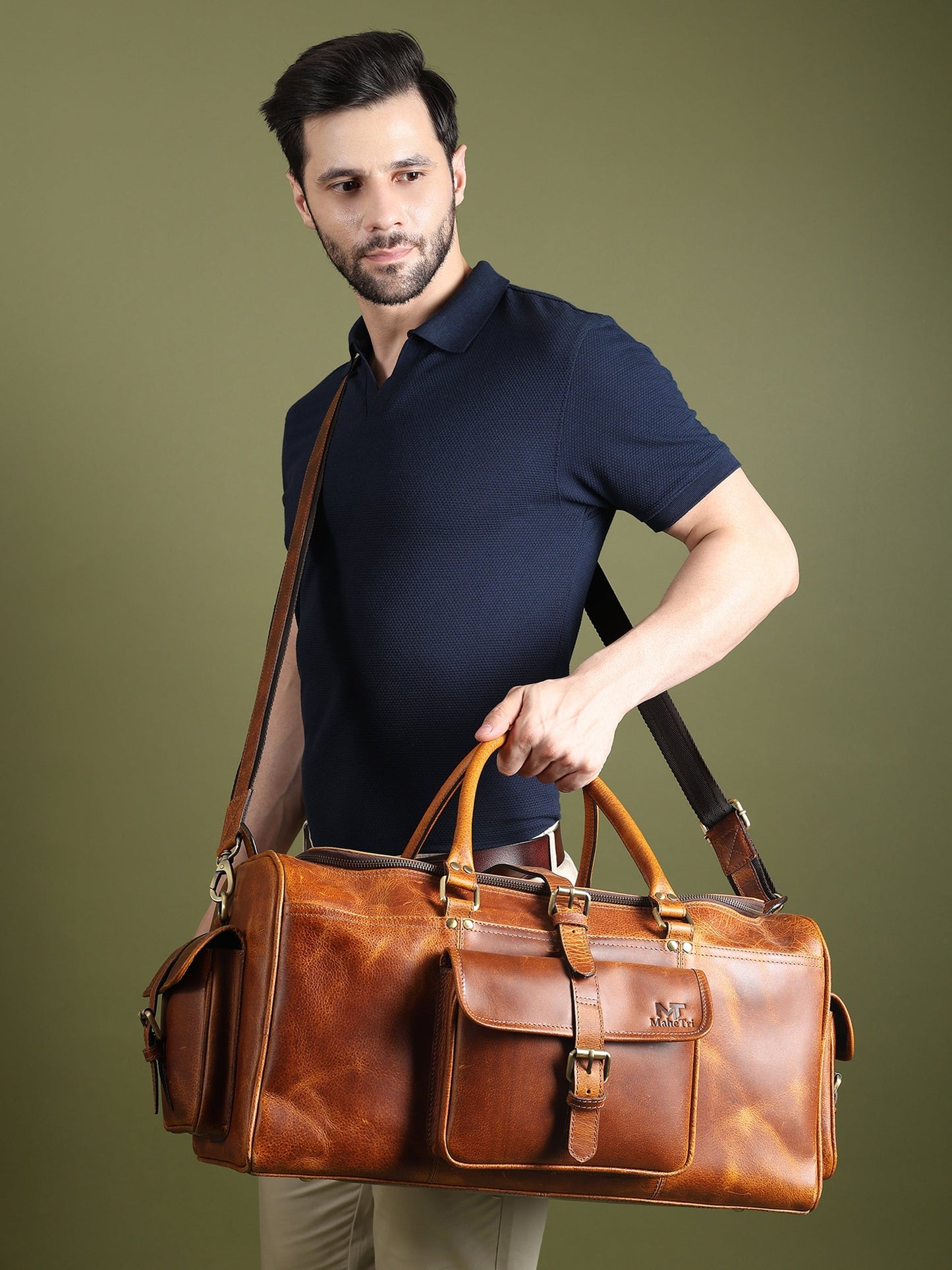 Berlin leather weekender duffle bag in brown leather with shoulder strap and front buckle pocket