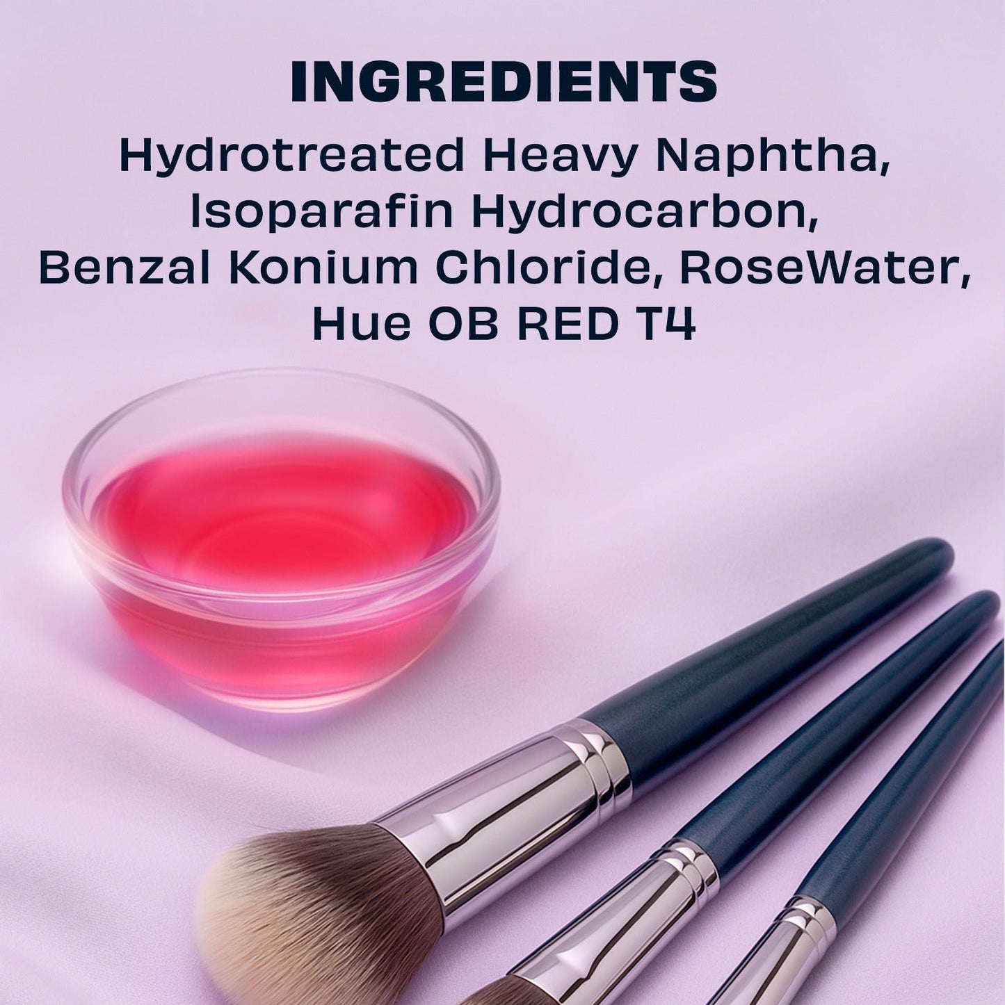 Three makeup brushes resting beside a small bowl of rose-pink cleaner
