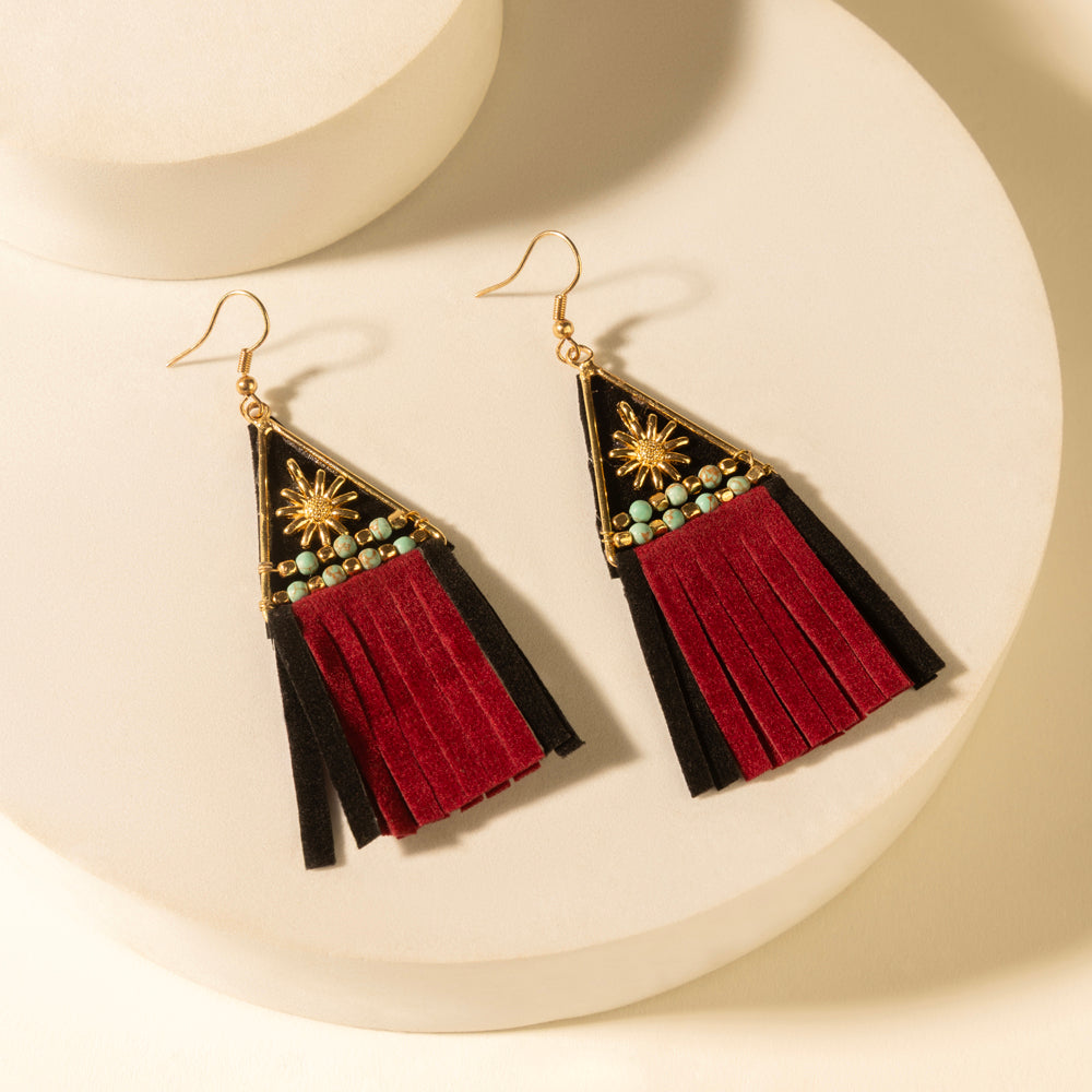Crest tassel earrings with gold hooks, black/red fringe, starburst beaded triangle details