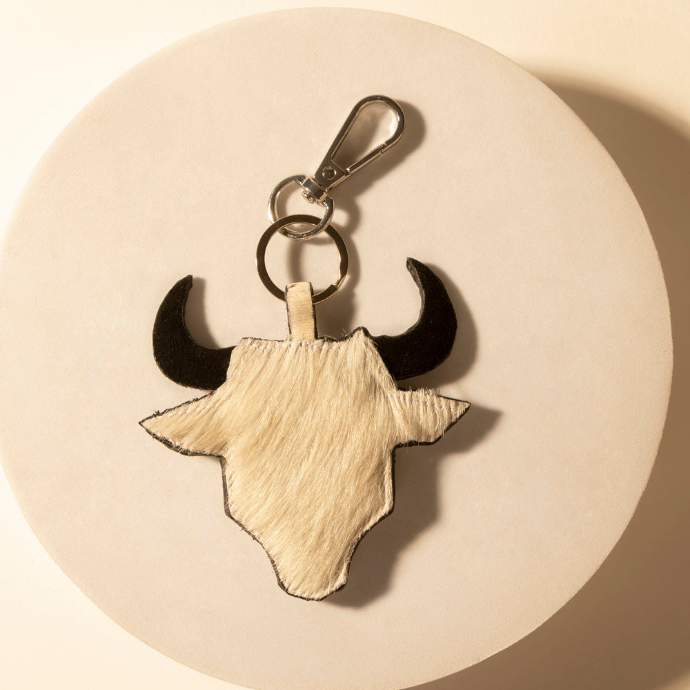 Longhorn skull keychain with metal key clip and ring, tan hide with black horn tips