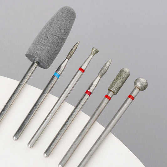Diamond nail drill bits set, angled view with multiple abrasive head shapes