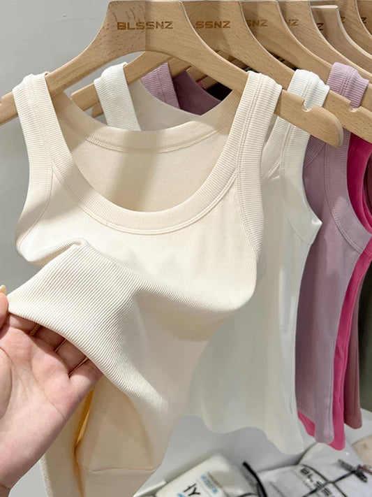 Women’s ribbed crew-neck tank top, white, sleeveless knit with wide arm openings.