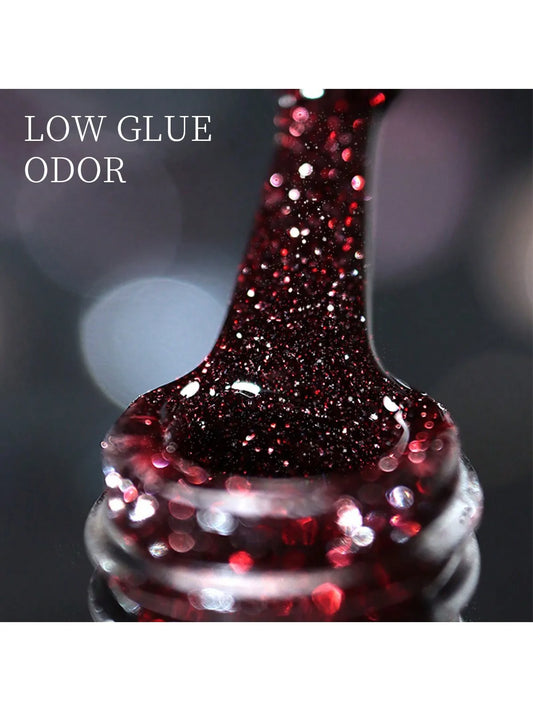 Dark red glitter nail gel polish bottle with sparkling broken-diamond texture