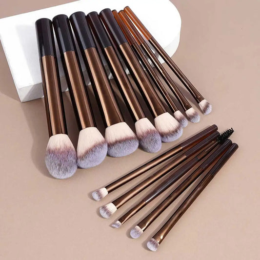 Makeup brush set with rose-gold and brown handles, assorted fluffy blending and contour heads.