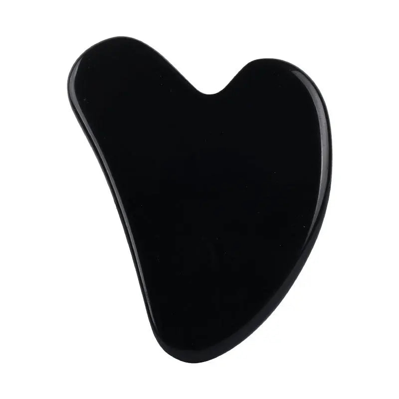 Facial gua sha stone massager, glossy black stone with heart-shaped curved scraping edge
