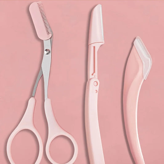 Pink eyebrow grooming kit: scissors, built-in comb, and crescent razor tool