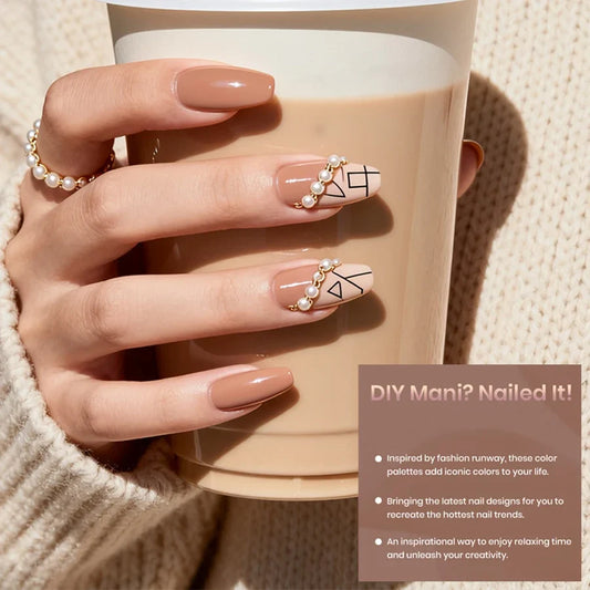 Nude pink gel nail polish manicure on hands with small glossy rounded nails