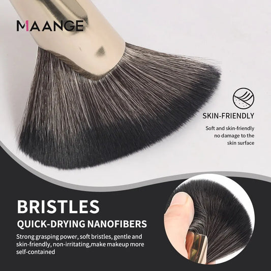 Angled makeup brush head with dense dark bristles and cream-colored handle