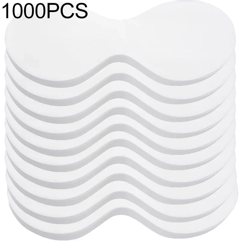 Stack of 1000 disposable white eye pads, curved under-eye shape